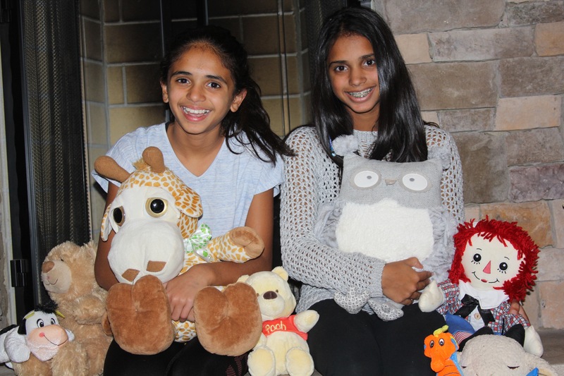 Riya, left, and Puja Jani collect stuffed animals for children in need. MELISSA STEELE PHOTO